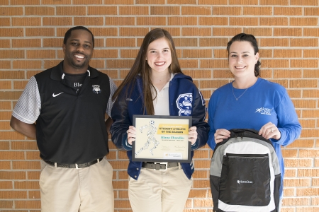 Alana Chandler with, from left, Springfield High School Lady Bulldogs Head Basketball Coach Byron Garner and North Oaks Sports Medicine Athletic Trainer Mandy Serpas.